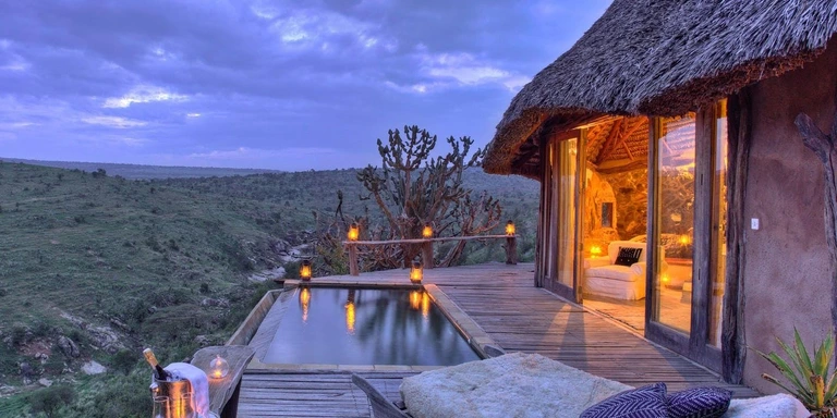 Private plunge pool and lodge deck overlooking the savanna